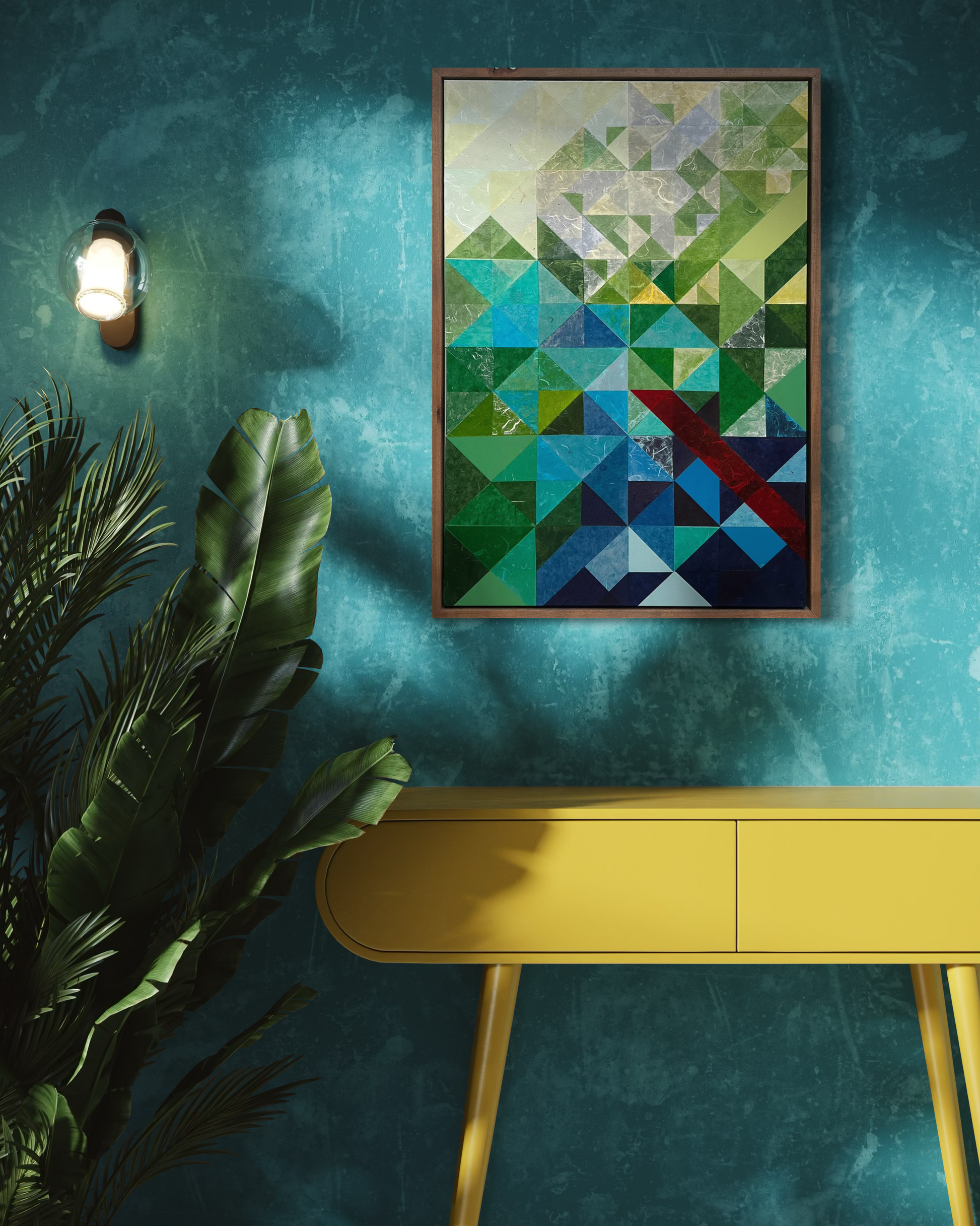 Colorful geometric abstract painting on a teal wall above a yellow table with a plant.